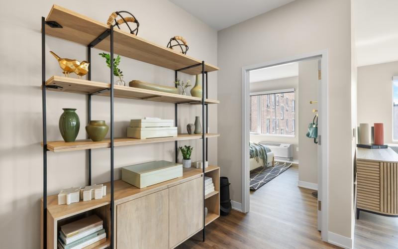 a room with shelves and books