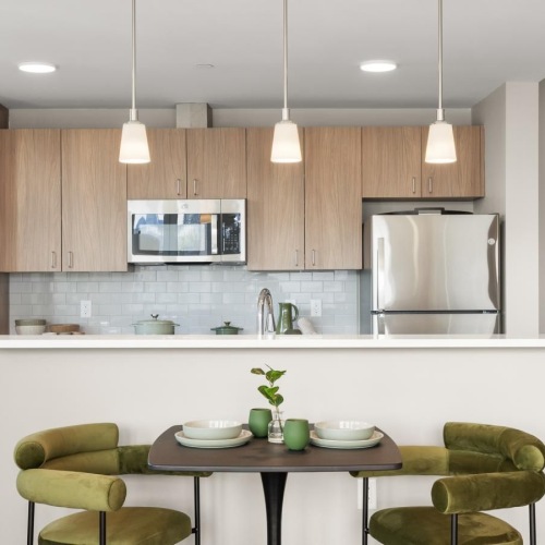 a kitchen with a table and chairs