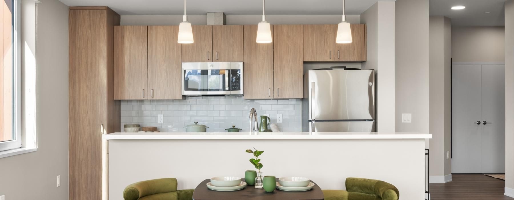a kitchen with a table and chairs