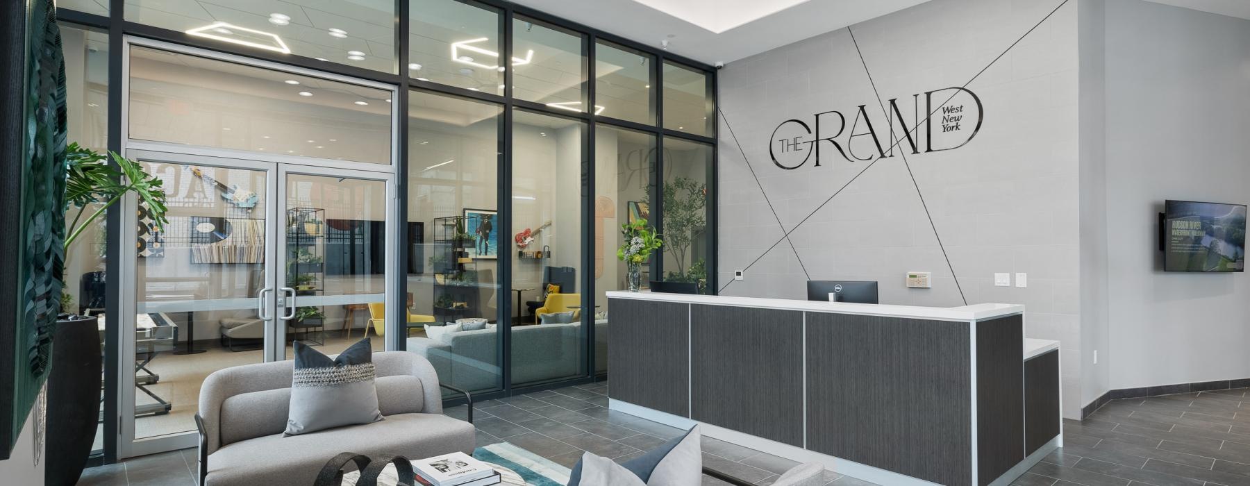 front desk area with chairs and glass walls