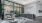 front desk area with chairs and glass walls