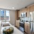a kitchen with a stainless steel refrigerator