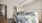 a bedroom with a bed and a mirror